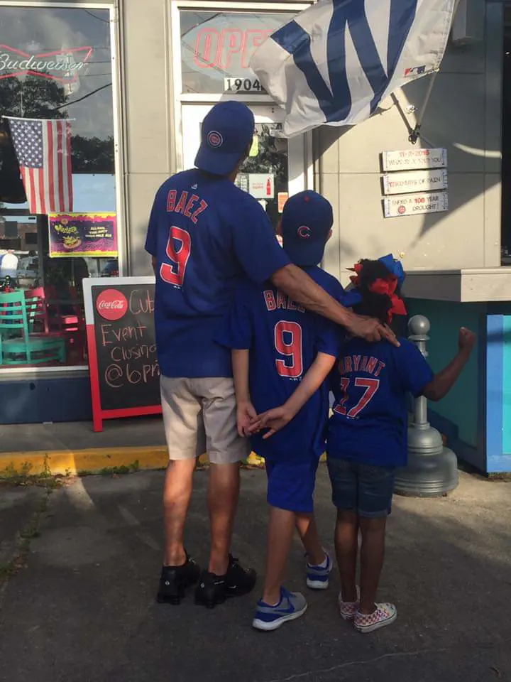 A family in matching Cubs jerseys outside Bruiser's
