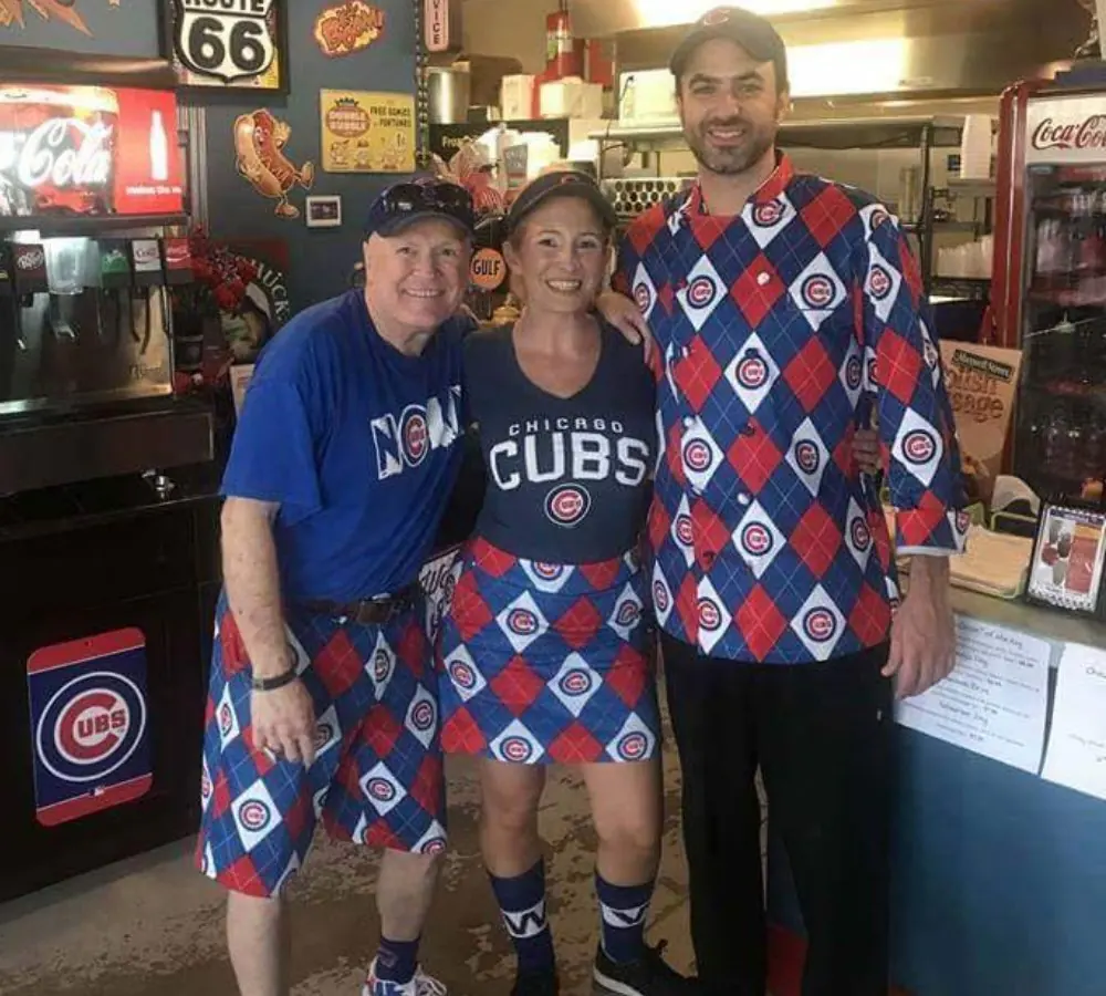 The Bruiser's crew in Cubs gear behind the counter